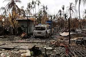 ARMY CRACKDOWN: A car stands next to a house that was burned down in Maungdaw in Rakhine State last year during a military campaign that the United States has denounced as ethnic cleansing. Human rights activists and researchers say they warned Facebook for years that its platform was being used to spread hate speech against Muslims in Myanmar. -- Photo: Reuters