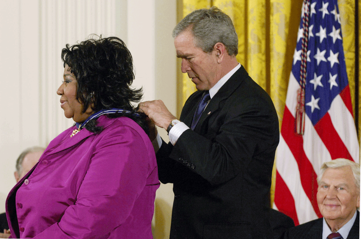 In this file photo taken on 9 November, 2005 US president George W Bush presents the Presidential Medal of Freedom, the nation`s highest civil award, to singer Aretha Franklin (L) as actor Andy Griffith (R) watches in the East Room of the White House in Washington, DC. Photo: AFP