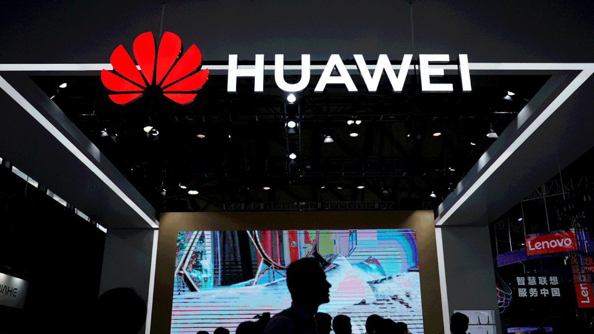 People walk past a Huawei sign in Shanghai. Photo: Reuters