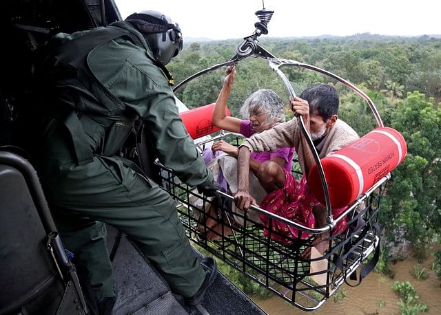 People are airlifted by the Indian Navy soldiers during a rescue operation at a flooded area in the southern state of Kerala, India on 17 August 2018. Photo: Reuters