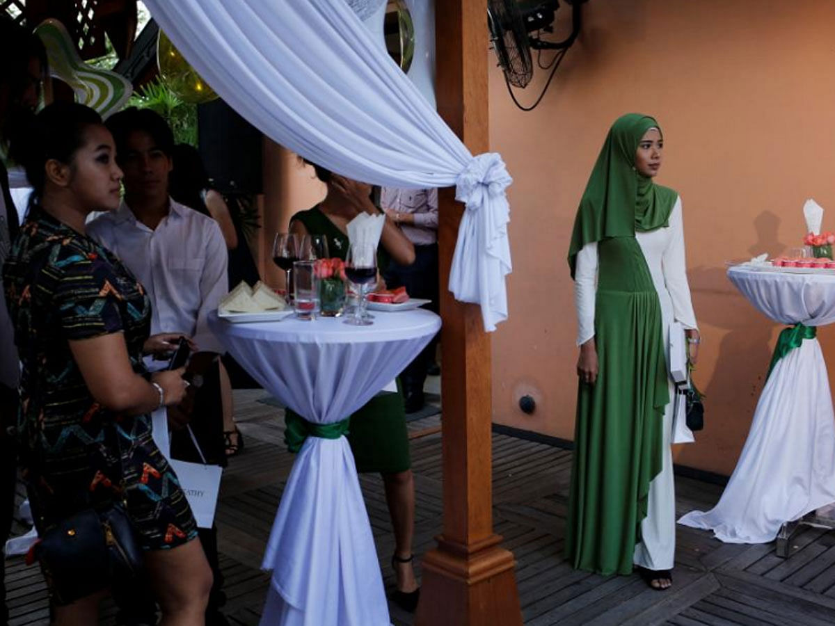 Blogger Win Lae Phyu Sin, 19, attends a beauty product launch event with other beauty bloggers in Yangon, Myanmar, on 1 May 2018. -- Reuters  Hijab like a key!