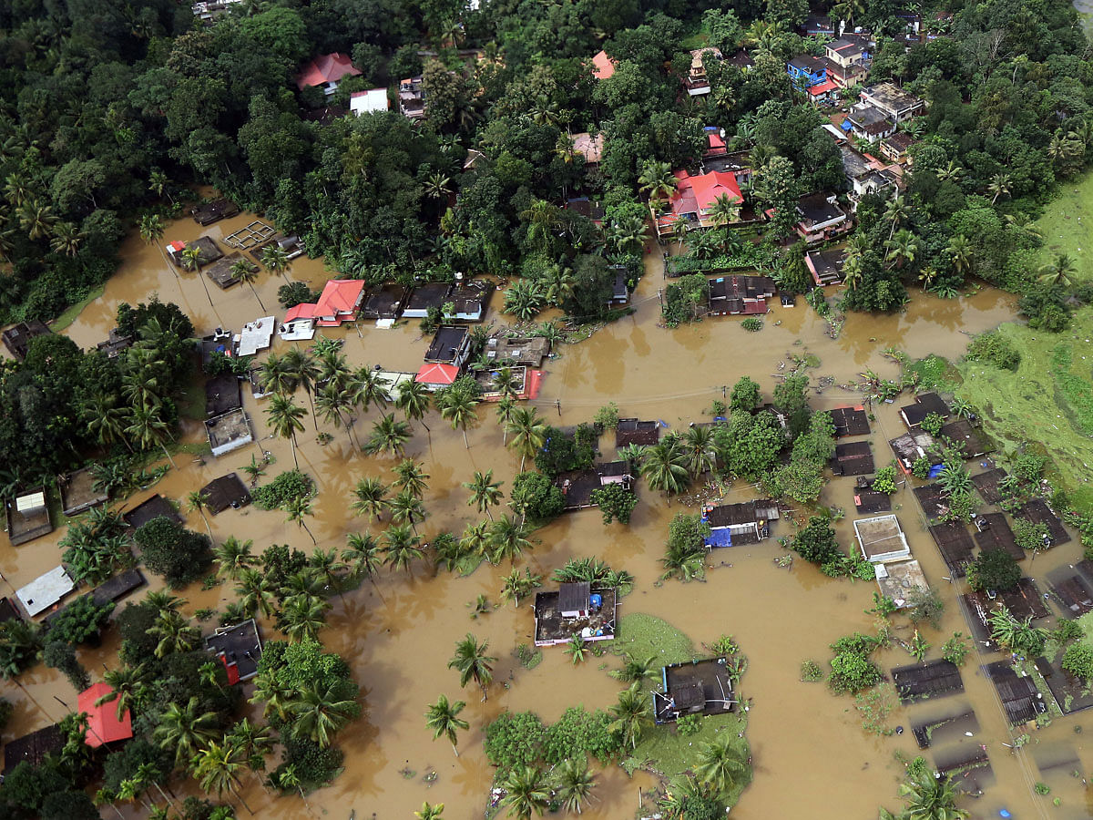 An aerial view shows partially submerged houses at a flooded area in the southern state of Kerala, India, on 17 August 2018. Reuters