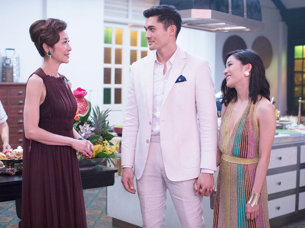 This image released by Warner Bros. Entertainment shows Michelle Yeoh, from left, Henry Golding and Constance Wu in a scene from the film `Crazy Rich Asians.` Photo: AP