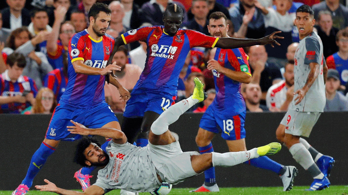 Soccer Football - Premier League - Crystal Palace v Liverpool - Selhurst Park, London, Britain - 20 August 2018 Crystal Palace`s Mamadou Sakho concedes a penalty against Liverpool`s Mohamed Salah. Reuters