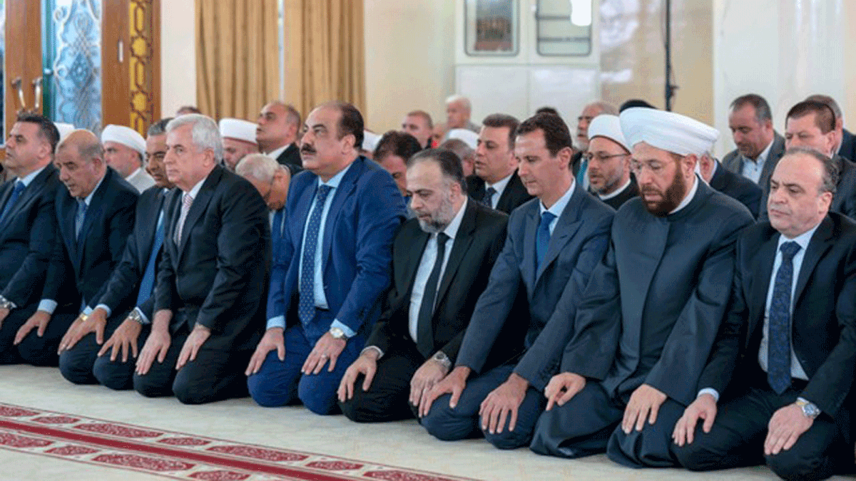 Syria`s president Bashar Al-Assad attends Eid al-Adha prayers at a mosque in Damascus, Syria in this handout picture provided by Syrian Arab News Agency on 21 August 2018. Photo: Reuters