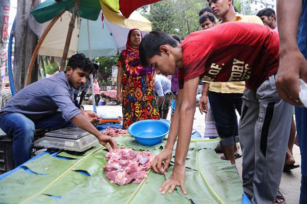 Meat of sacrificial animals, collected from different city areas by the poor, is being sold in the capital`s Banasree area on 22 August, 2018. Photo: Dipu Malakar