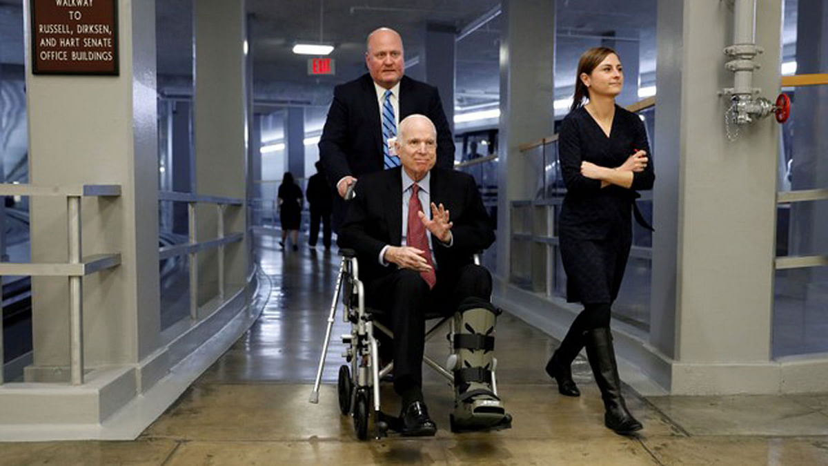 US Senator John McCain heads to the Senate floor ahead of votes on Capitol Hill in Washington, US on 6 December 2017. Photo: Reuters