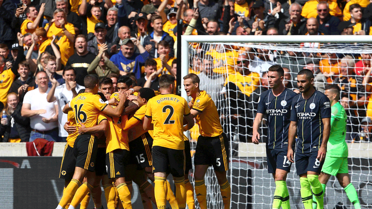 Wolverhampton Wanderers` French defender Willy Boly (C) celebrates with team-mates after scoring the opening goal during the English Premier League football match between Wolverhampton Wanderers and Manchester City at the Molineux stadium in Wolverhampton, central England on 25 August, 2018. Photo: AFP
