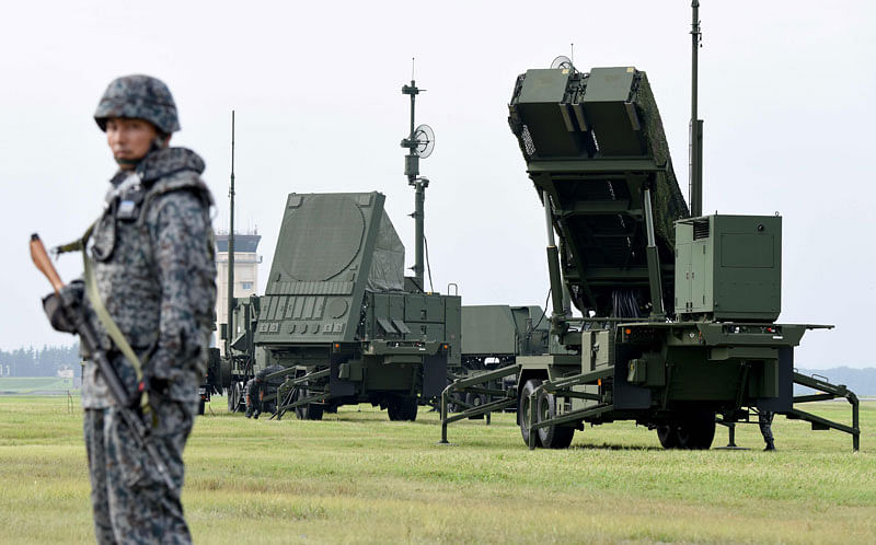 In this file photo taken on 29 August, 2017, soldiers from the Japan Air Self-Defence Force set up PAC-3 surface-to-air missile launch systems during a temporary deployment drill at US Yokota Air Bace in Tokyo. Photo: AFP
