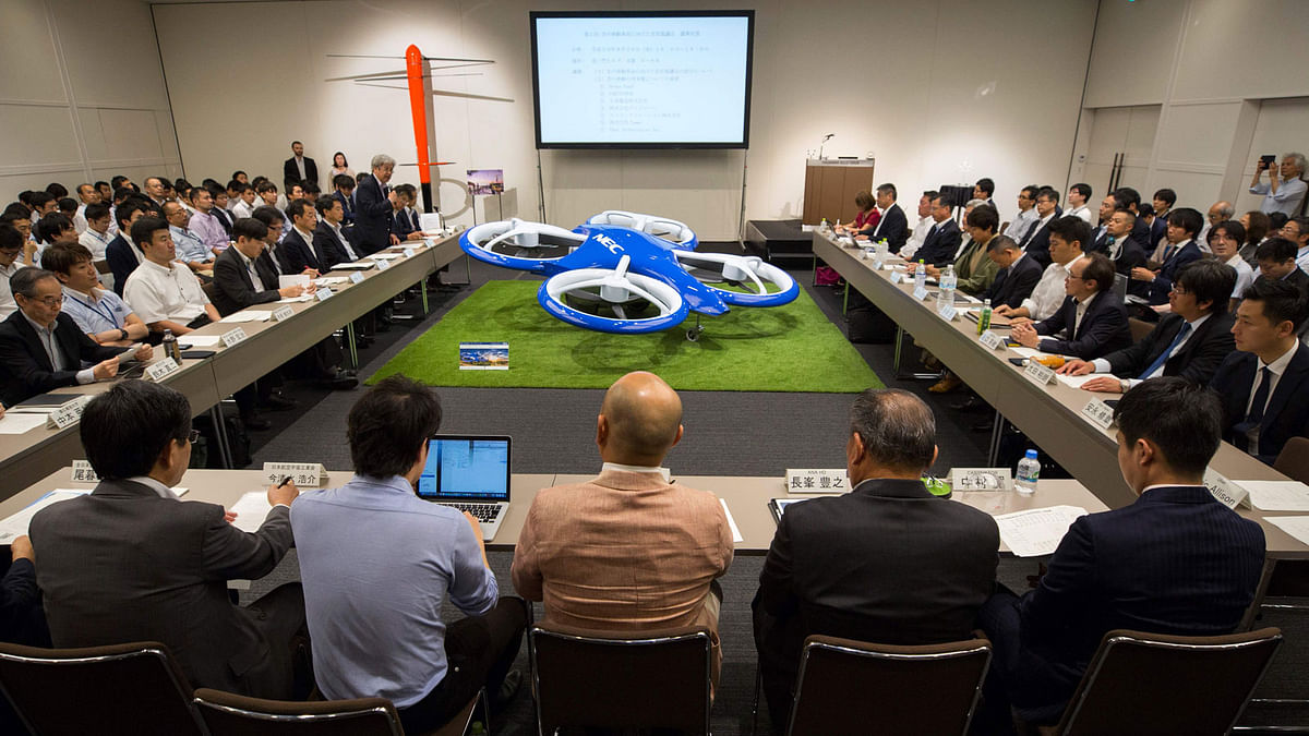 Executives of transportation companies attend a government-led meeting on developing flying cars and airborne vehicles in Tokyo on 29 August 2018. Photo: AFP