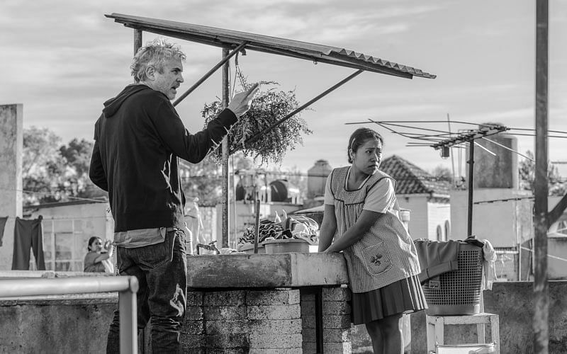 This image released by Netflix shows filmmaker Alfonso Cuaron on the set of `Roma,` premiering on 19 October. Photo: AP
