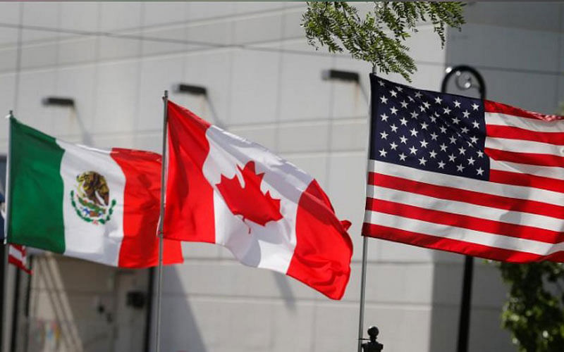 Flags of the US, Canada and Mexico fly next to each other in Detroit, Michigan, US on 29 August. Photo: Reuters
