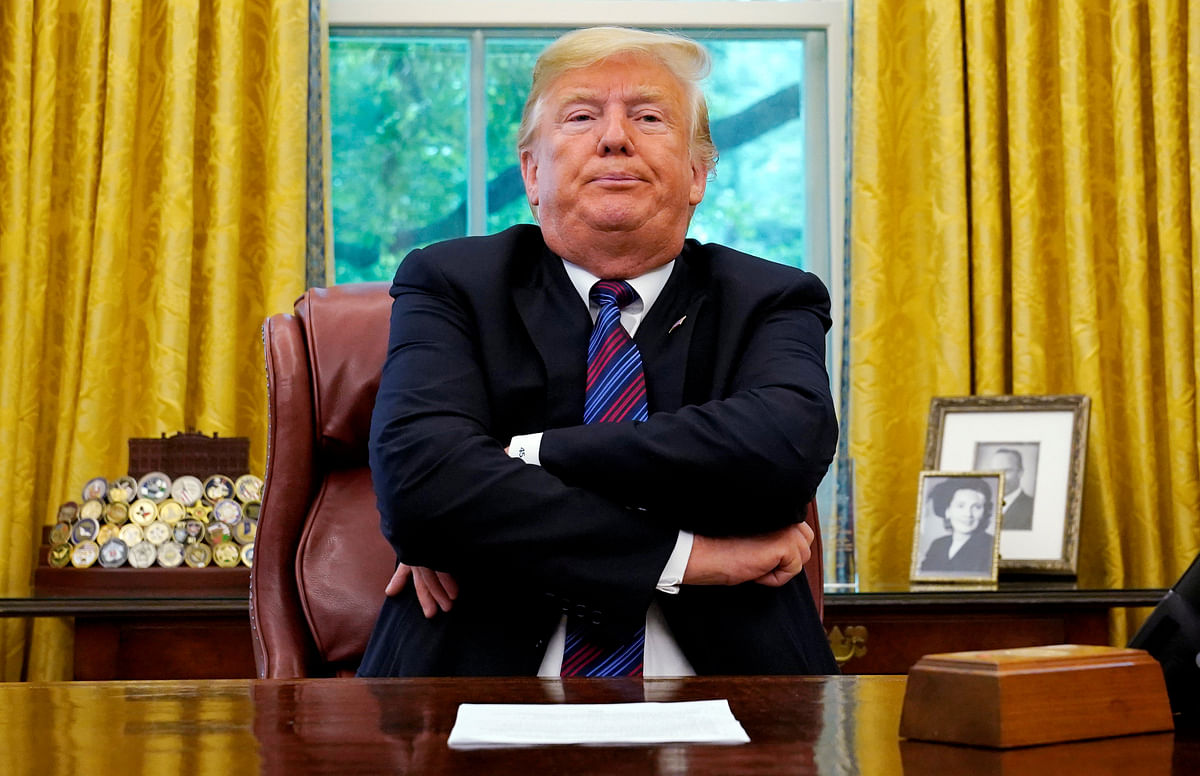 President Trump sits behind his desk as he makes announcement about a bilateral trade deal with Mexico at the White House in Washington. Reuters