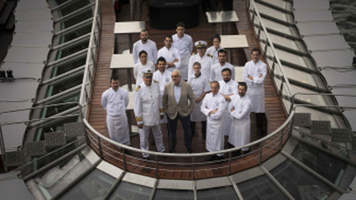 French chef Alain Ducasse (C) poses with his team on his new boat restaurant, the `Ducasse sur Seine` on 30 August 2018 in Paris). Photo: AFP
