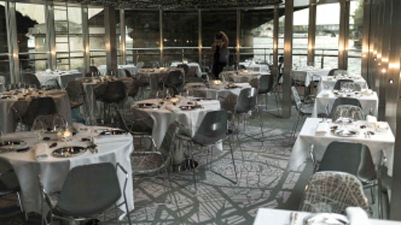 Dressed tables are seen at French chef Alain Ducasse`s new boat restaurant, the `Ducasse sur Seine`, on 30 August 2018 in Paris. Photo: AFP