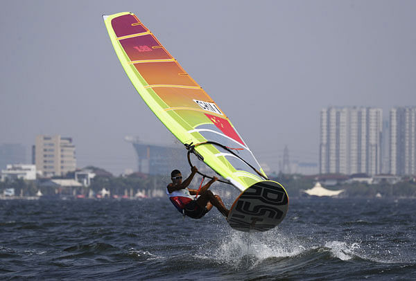Bi Kun of China competes at Indonesia National Sailing Centre in Jakarta, Indonesia. Photo: AP