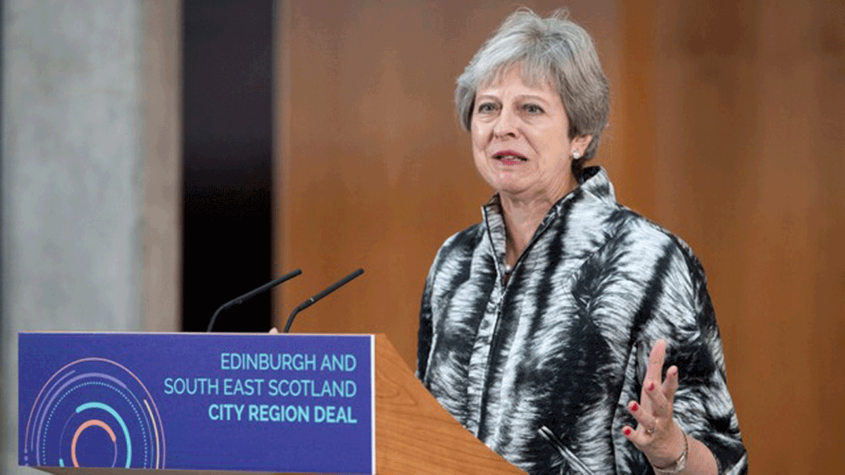Britain`s prime minister Theresa May speaks at the University of Edinburgh before signing the Edinburgh and South East Scotland City Region Deal in Edinburgh, Scotland, 7 August 2018. Photo: Reuters