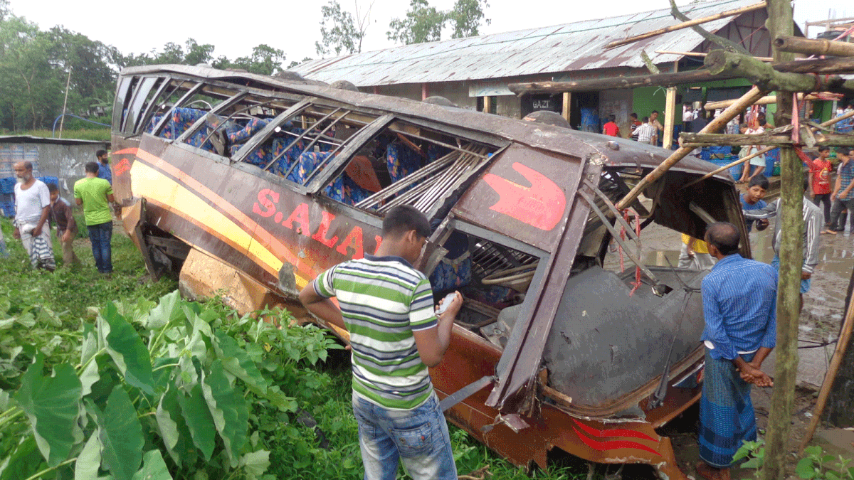 A passenger bus is damaged after being hit by a train in Mirsharai upazila of Chattogram early Sunday. Photo: Iqbal Hossain