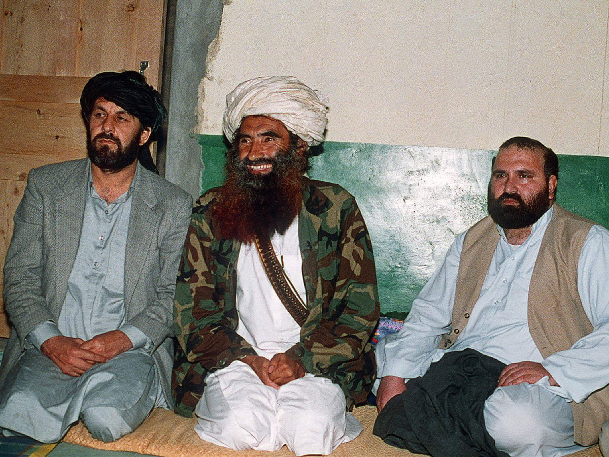 This picture taken on April 2, 1991 shows Afghan commander Jalaluddin Haqqani (C) with two top guerilla commanders Amin Wardak and Abdul Haq at his Pakistani base in Miranshah. Photo: AFP