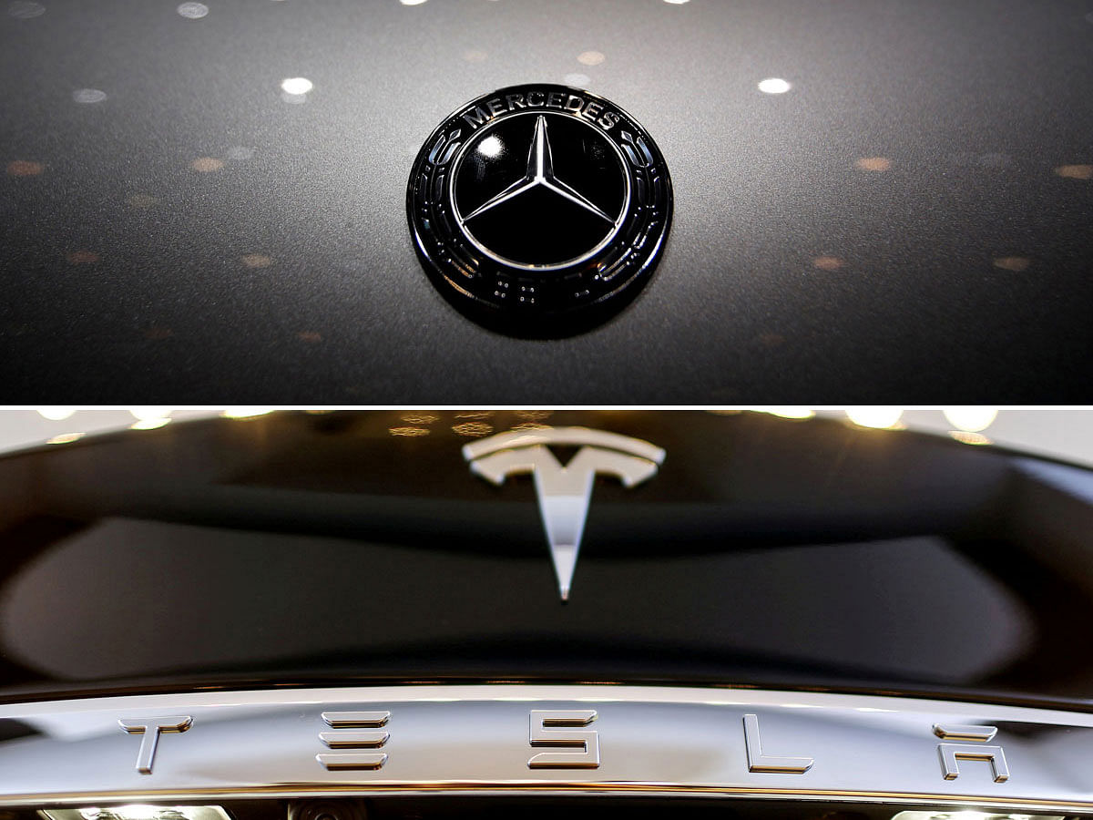 Logos of Mercedes-Benz and Tesla. Photo: Reuters