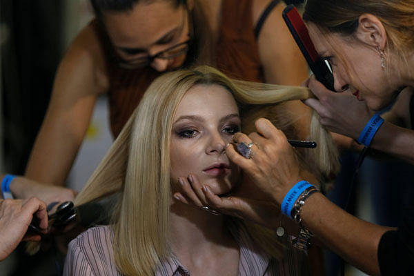 A model has her make-up applied backstage at the Ukrainian Fashion Week in Kiev, Ukraine on 4 September. Photo: Reuters