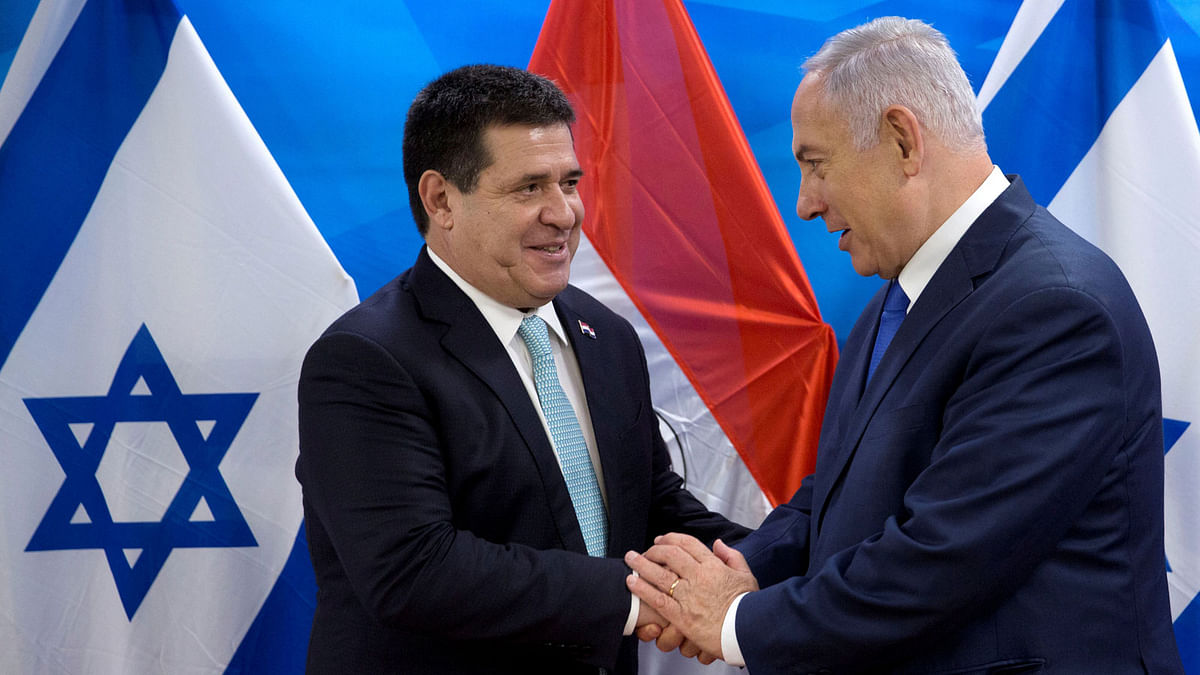 Paraguayan president Horacio Cartes shakes hands with Israeli prime minister Benjamin Netanyahu during a meeting at the latter’s office in Jerusalem, following the dedication ceremony of the embassy of Paraguay in Jerusalem, on 21 May 2018. Reuters File Photo