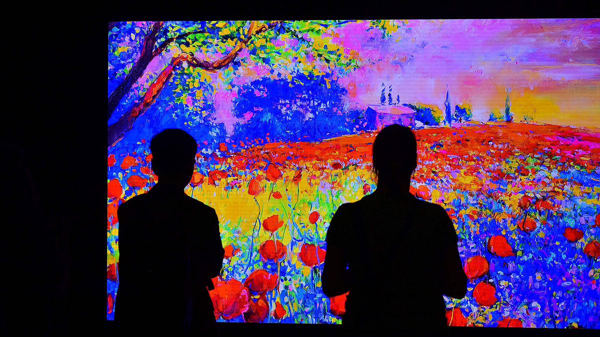 Visitors look on a television installation at the booth of Samsung during the IFA, the world`s leading trade show for consumer electronics and home appliances, in Berlin. Photo: AFP