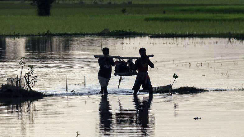 Two men returning from the farming lands at the dusk at Batiaghata in Khulna. A recent photo by Saddam Hossain