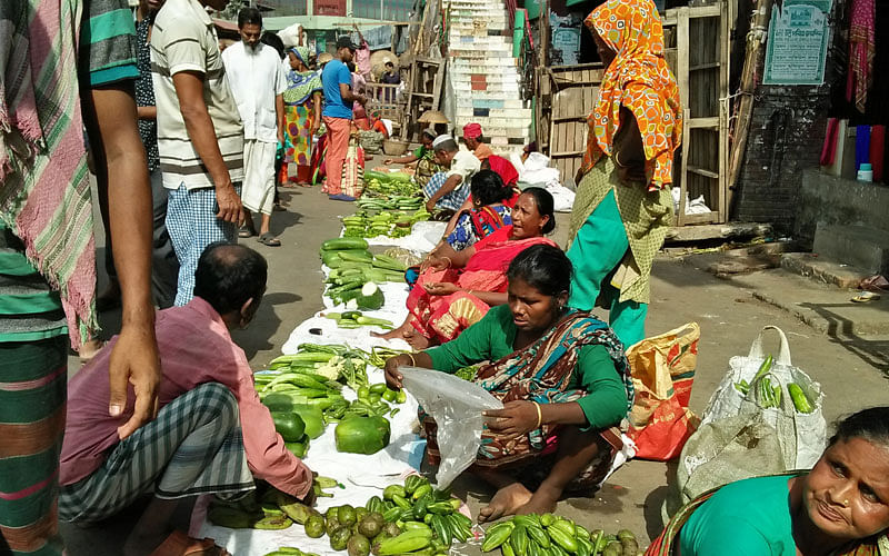 A good number of women vendors sell vegetables in the morning at Karwan Bazar kitchen market, Dhaka everyday. The picture was taken on 9 September by Nusrat Nowrin.