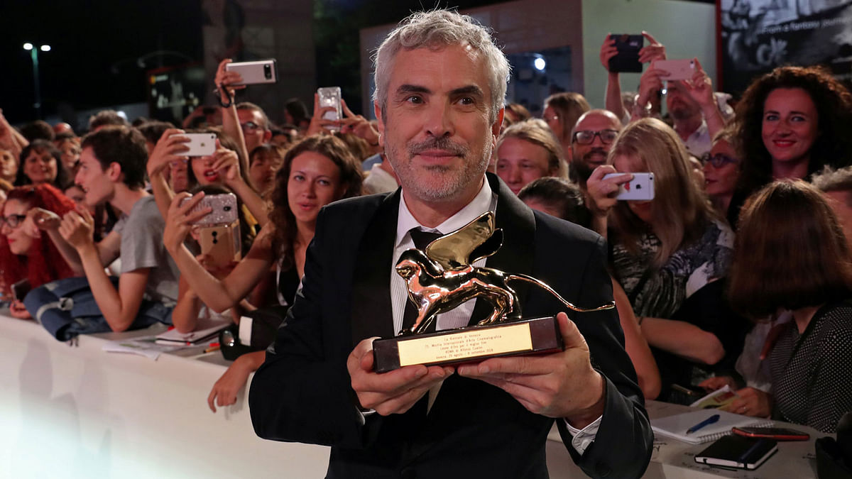 The 75th Venice International Film Festival - Awards Ceremony - Venice, Italy, 8 September, 2018 - Director Alfonso Cuaron poses with the Golden Lion for Best Film. Photo: Reuters