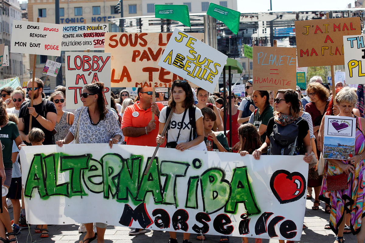 Environmental activists gather to urge world leaders to take action against climate change in Marseille. Photo: Reuters