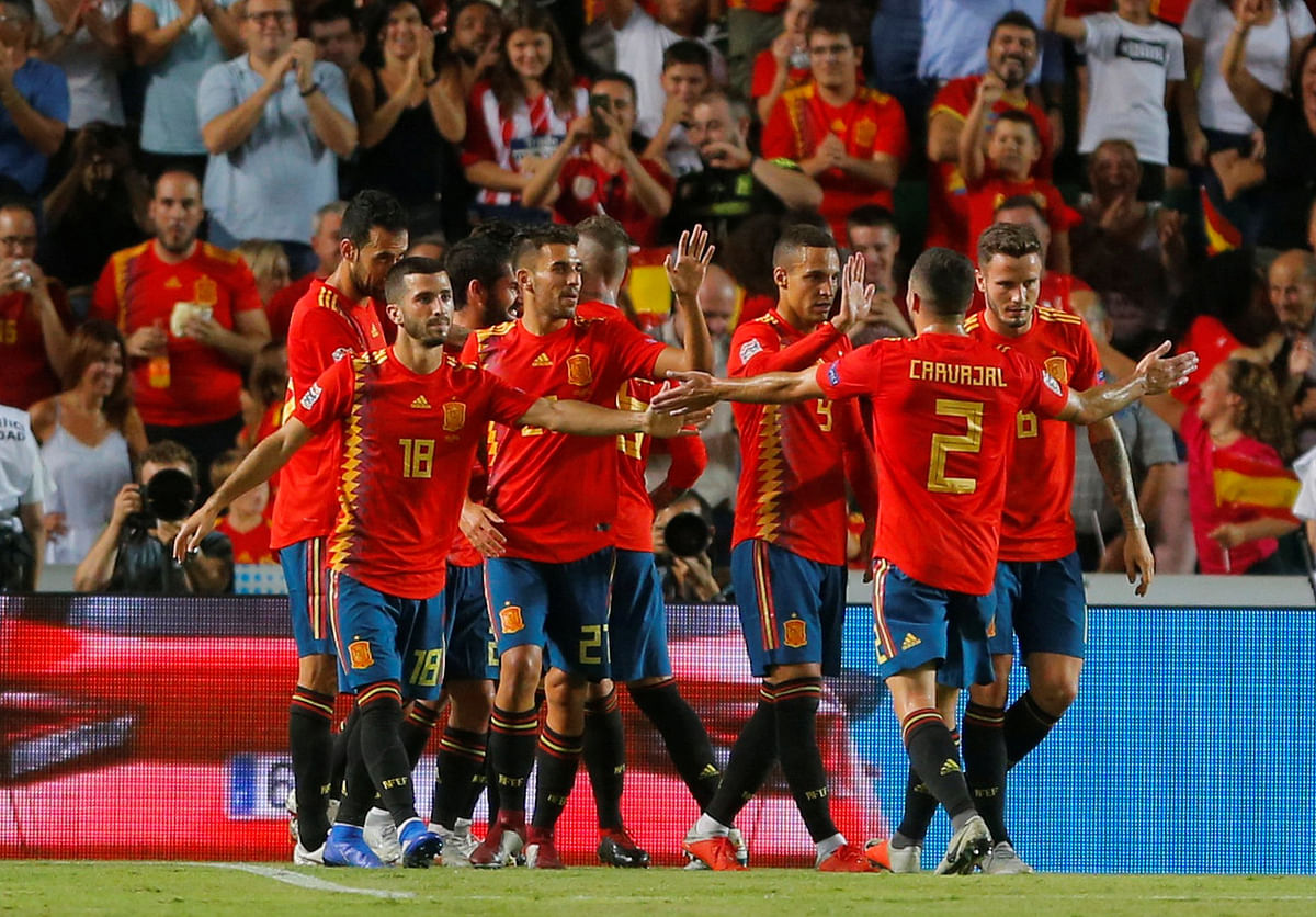 Spain`s Sergio Ramos celebrates scoring their fifth goal with team mates. Photo: Reuters