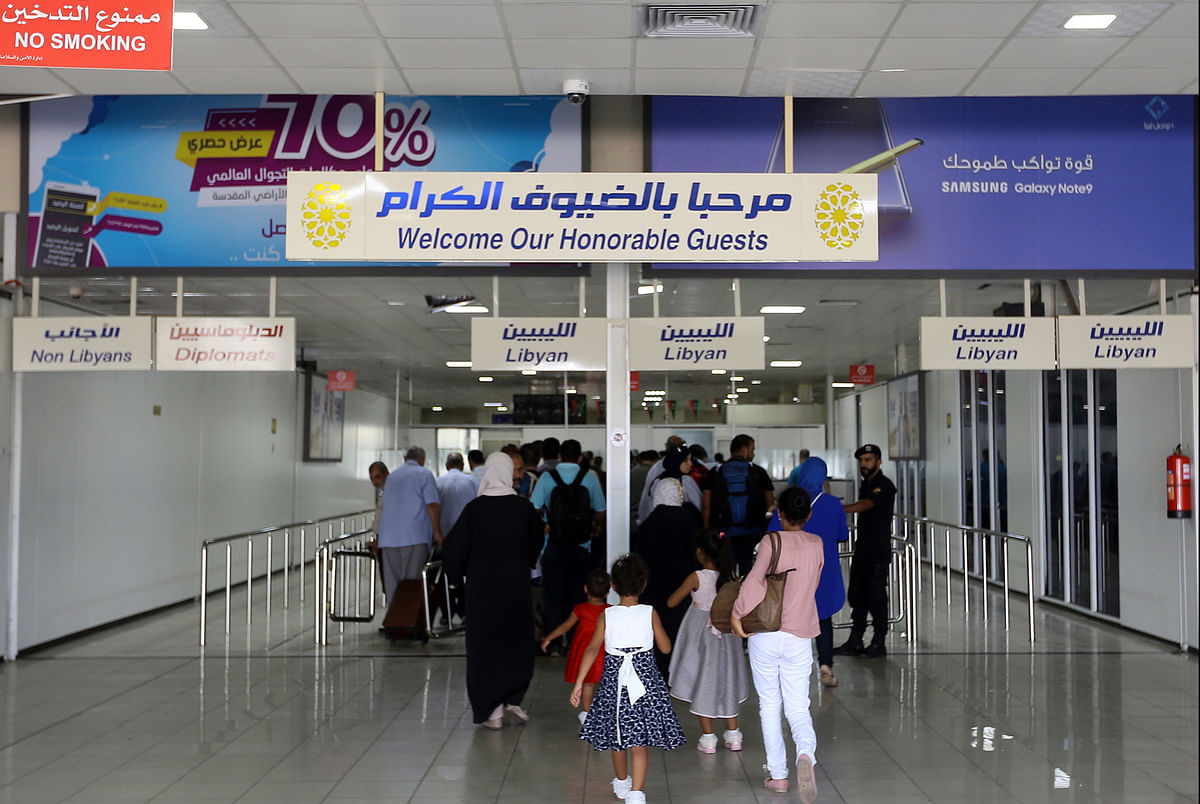 Travellers arrive at the Mitiga International Airport after its reopening on 7 September 2018, in the Libyan capital of Tripoli. Photo: AFP