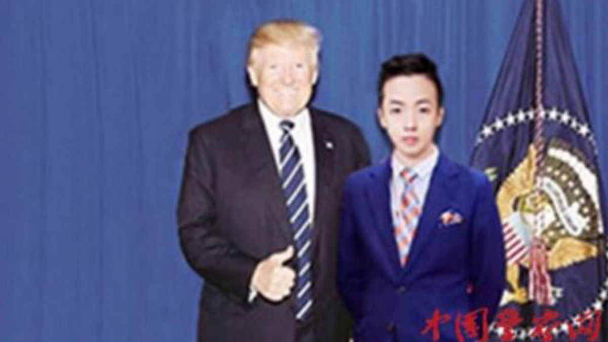 A 17-year-old junior high school dropout in Photoshopped picture with US president Donald Trump -- Image: The Straits Times