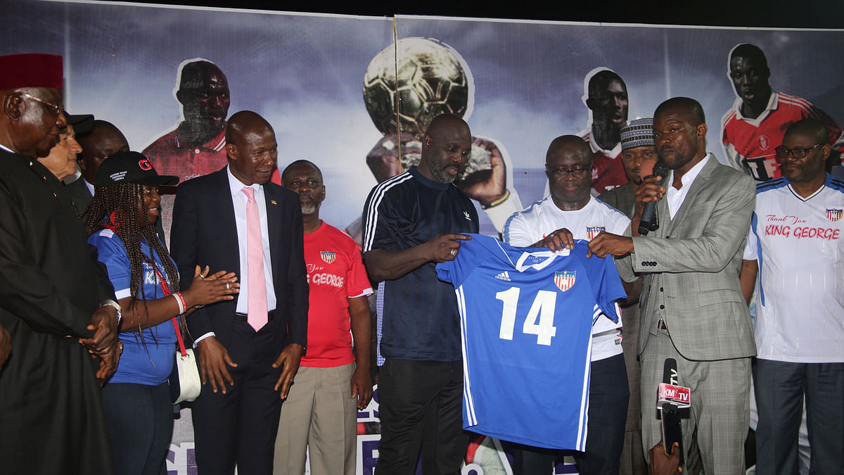 Liberia`s president and former World Footballer of the Year George Weah carries his number 14 jersey after an international friendly soccer match between Liberia and Nigeria in Monrovia, Liberia on 11 September, 2018. Photo: Reuters