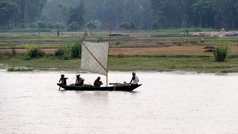 A boat sailing across the river Jamuna in Dighapara, Sariakandi, Bogura on 12 September. Photo: Soel Rana