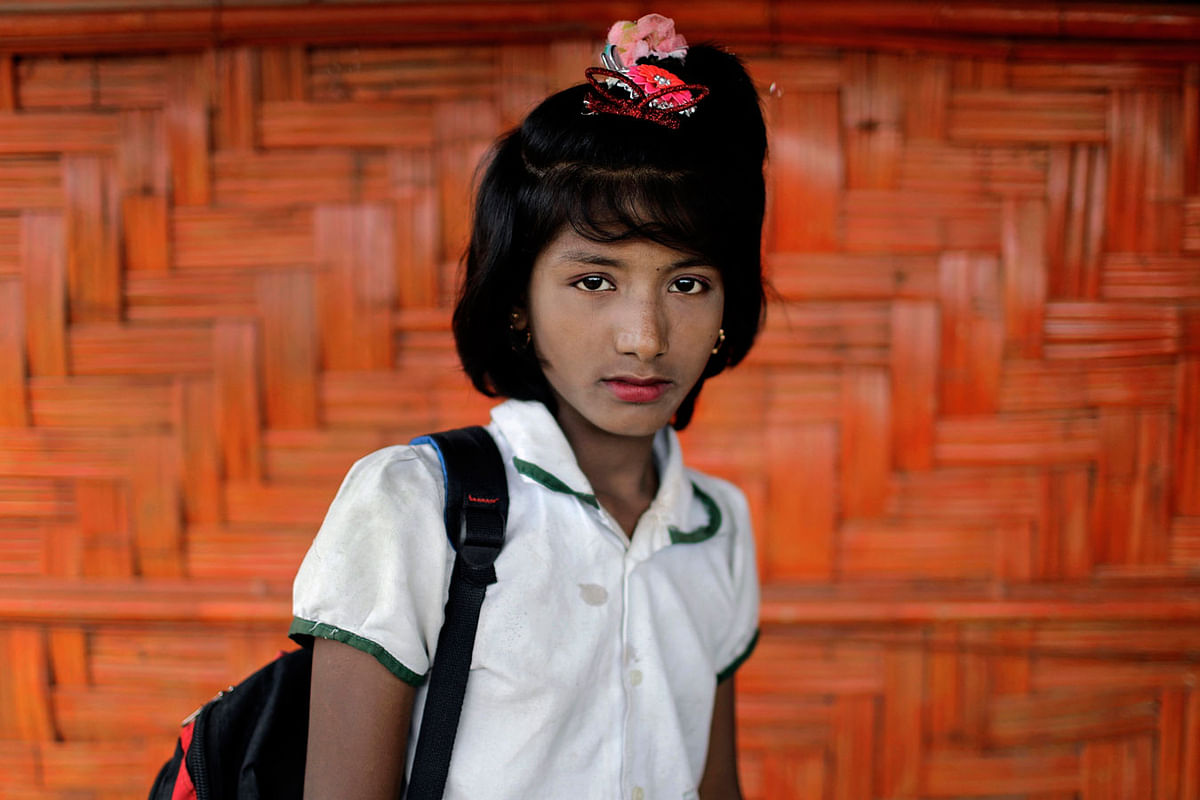In this 27 June 2018, photo, Dil Kayas, 12, poses for a portrait in front of her classroom in Chakmarkul refugee camp, Bangladesh. Photo: AP