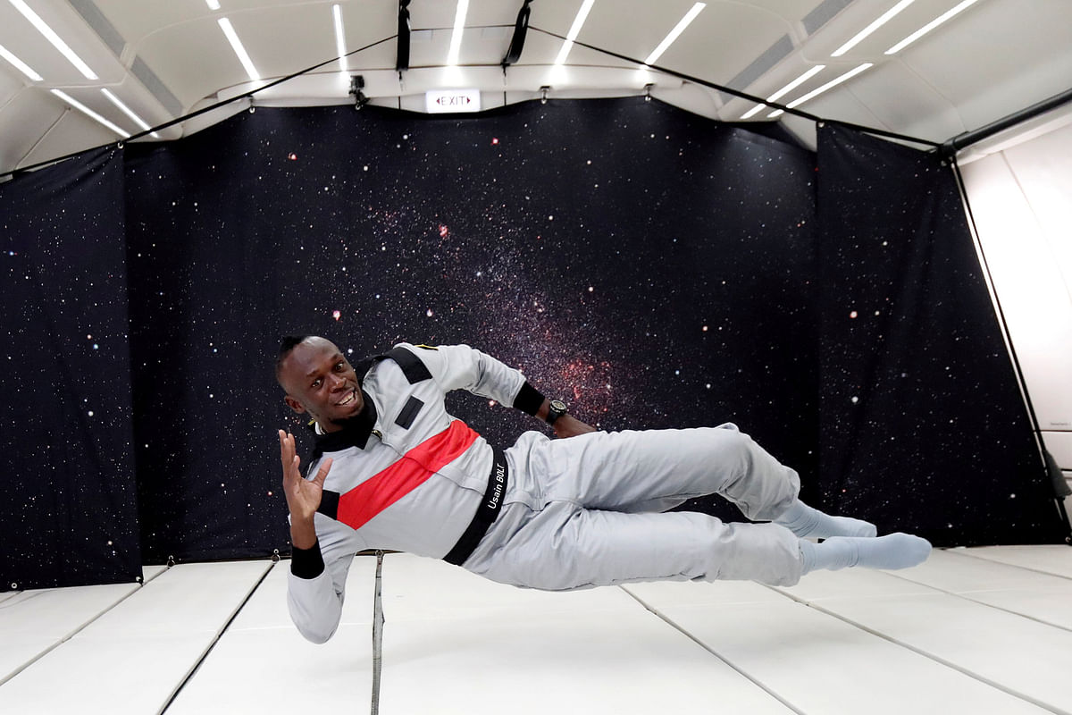 Retired sprinter Usain Bolt poses as he enjoys zero gravity conditions during a flight in a specially modified plane above Reims. Photo: Reuters