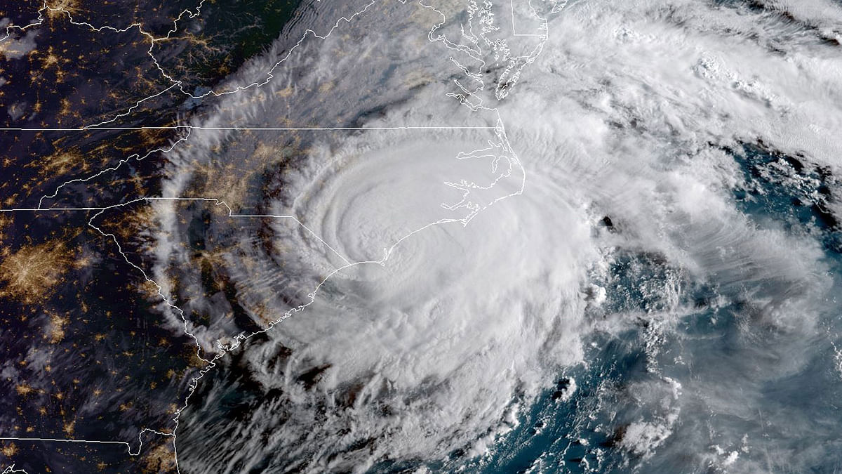 This NOAA/RAMMB satellite image taken at 12:00 UTC on 14 September, 2018, shows Hurricane Florence making landfall on US east coast. Photo: AFP