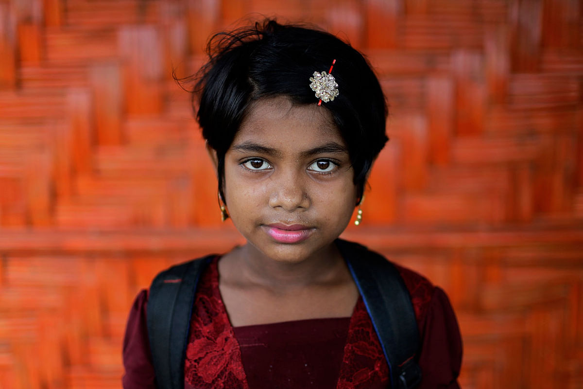 In this 27 June 2018, photo, Nazifa, 10, poses for a portrait in front of her classroom in Chakmarkul refugee camp, Bangladesh. Photo: AP