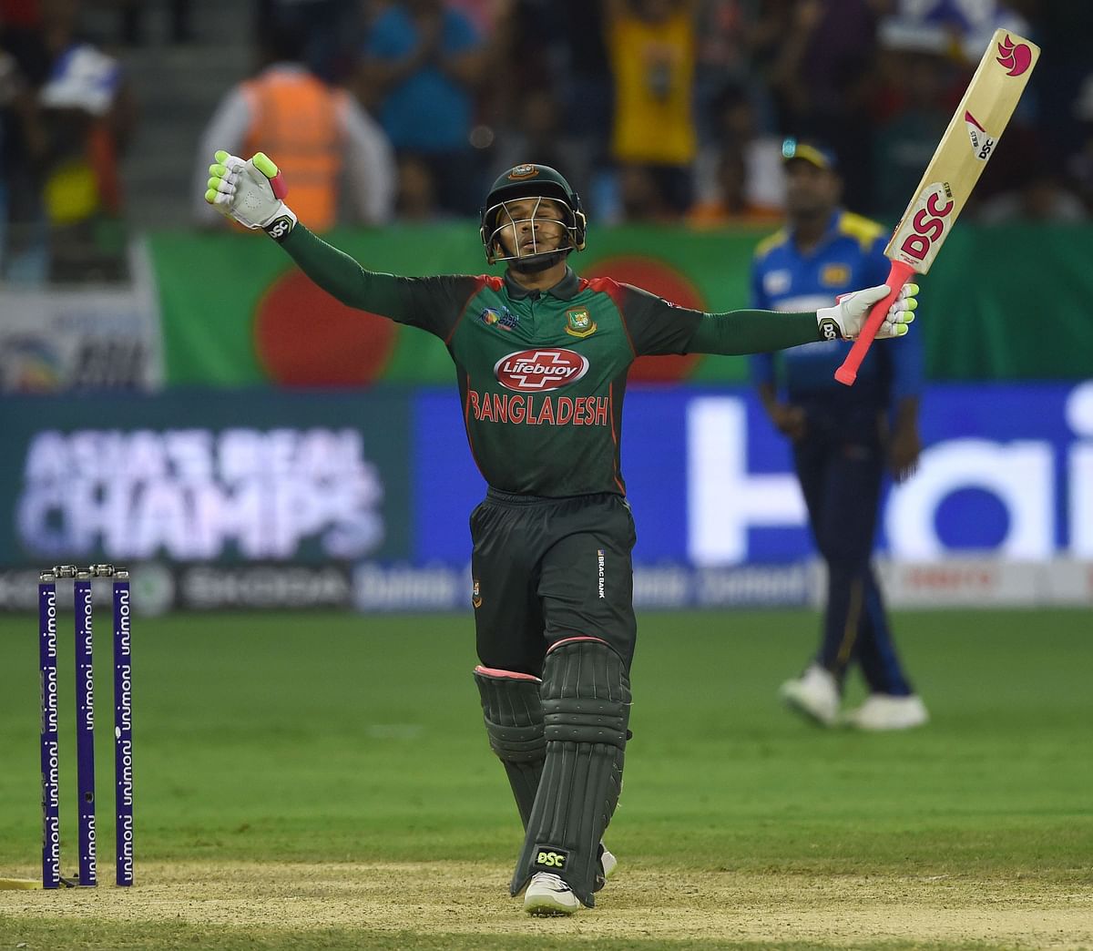 Mushfiqur Rahim celebrates after scoring 100 runs during the one day international (ODI) Asia Cup cricket match between Bangladesh and Sri Lanka at the Dubai International Cricket Stadium in Dubai on 15 September, 2018. Photo: AFP