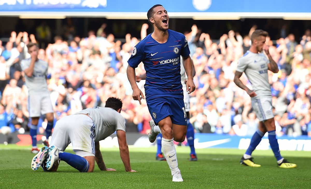 Chelsea`s Belgian midfielder Eden Hazard celebrates scoring his team`s first goal during the English Premier League football match between Chelsea and Cardiff City at Stamford Bridge in London on September 15, 2018. AFP