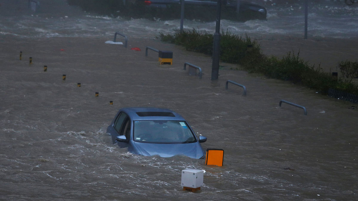 A car is stranded in seawater as high waves hit the shore at Heng Fa Chuen, a residental district near the waterfront, during Typhoon Mangkhut in Hong Kong, China on 16 September 2018. Photo: Reuters