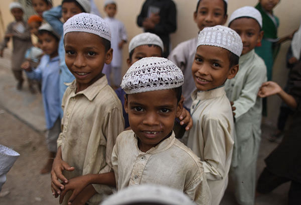 Children of Bangalee immigrants living in Pakistan look on at a madrasa in Karachi on 17 September, 2018. Photo: AFP