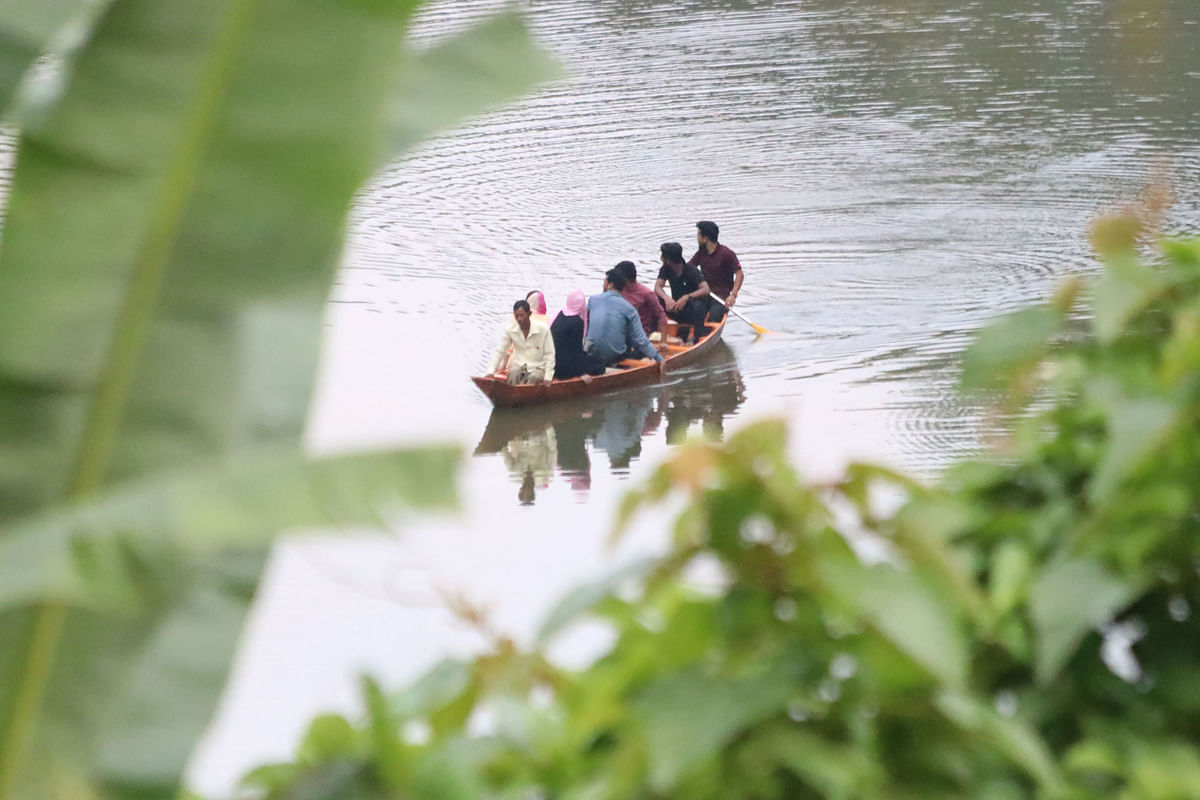 Tourists on a boat over the lake at the district council park in Khagrachhari on 16 September. Photo: Nerob Chowdhury