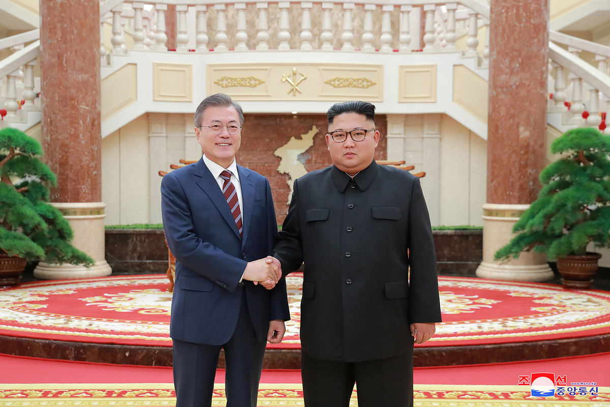 South Korean President Moon Jae-in shakes hands with North Korean leader Kim Jong Un as they arrive for their meeting at the headquarters of the Central Committee of the Workers` Party of Korea in Pyongyang. Photo: AFP