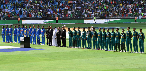 Indian and Pakistan (R) players line up for the national anthem just before the start of the one day international (ODI) Asia Cup cricket match between Pakistan and India at the Dubai International Cricket Stadium in Dubai on 19 September 2018. Photo: AFP
