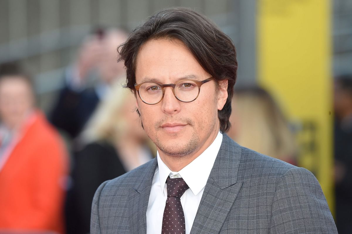 In this file photo taken on September 13, 2018 US director Cary Joji Fukunaga poses on the red carpet upon arrival for the world premiere of the film `Maniac` in central London. US filmmaker Cary Joji Fukunaga will direct the next James Bond movie, after British director Danny Boyle dramatically quit the project last month. Photo: AFP