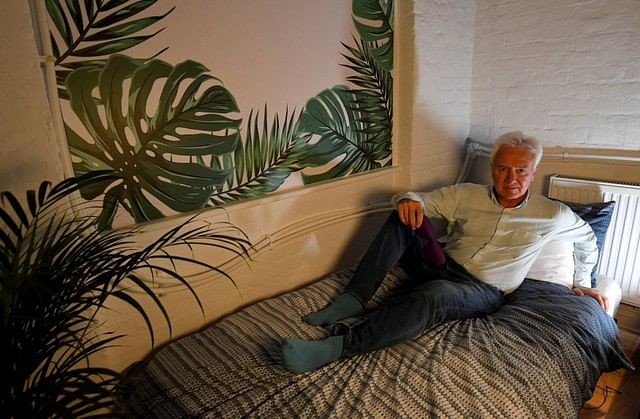Graeme Daniel, a regular user of Pop & Rest sits in one of the pods, allowing workers and travellers a place to rent by the hour to relax and rest in Shoreditch, London, Britain, 18 September 2018. Photo: Reuters