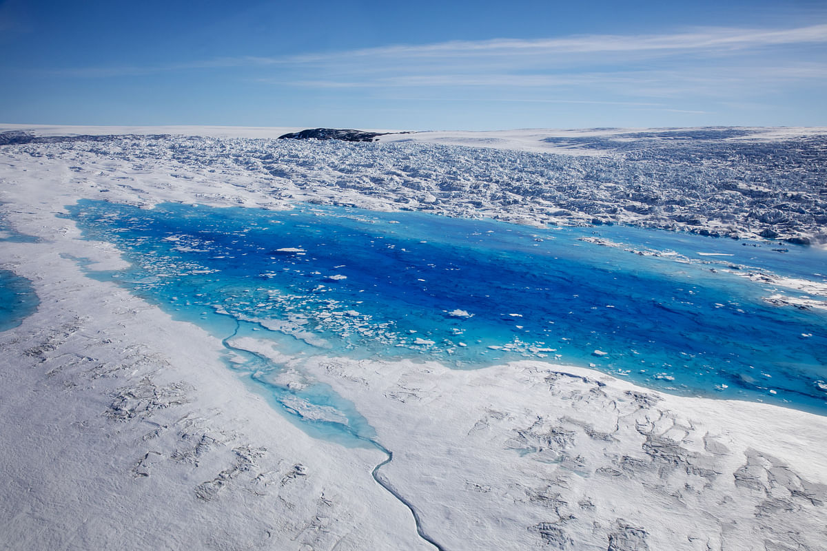 Meltwater pools are seen on top of the Helheim glacier near Tasiilaq, Greenland, on 19 June 2018. Photo: Reuters